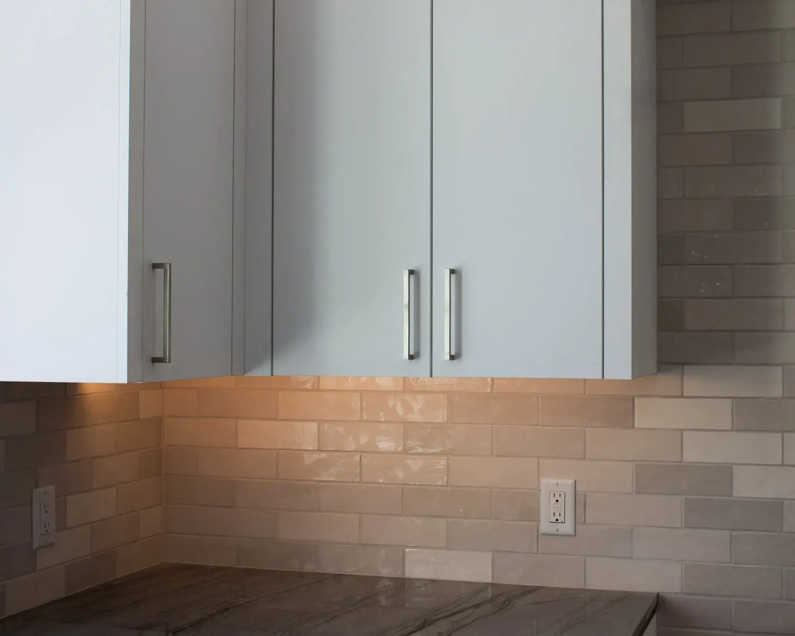 Kitchen counters lit edge to edge with under cabinet strips